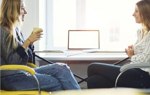 Two women talking and smiling